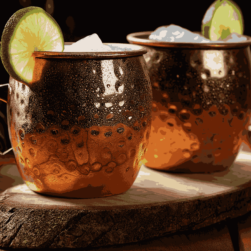 A Moscow Mule served in a copper mug with lime garnish