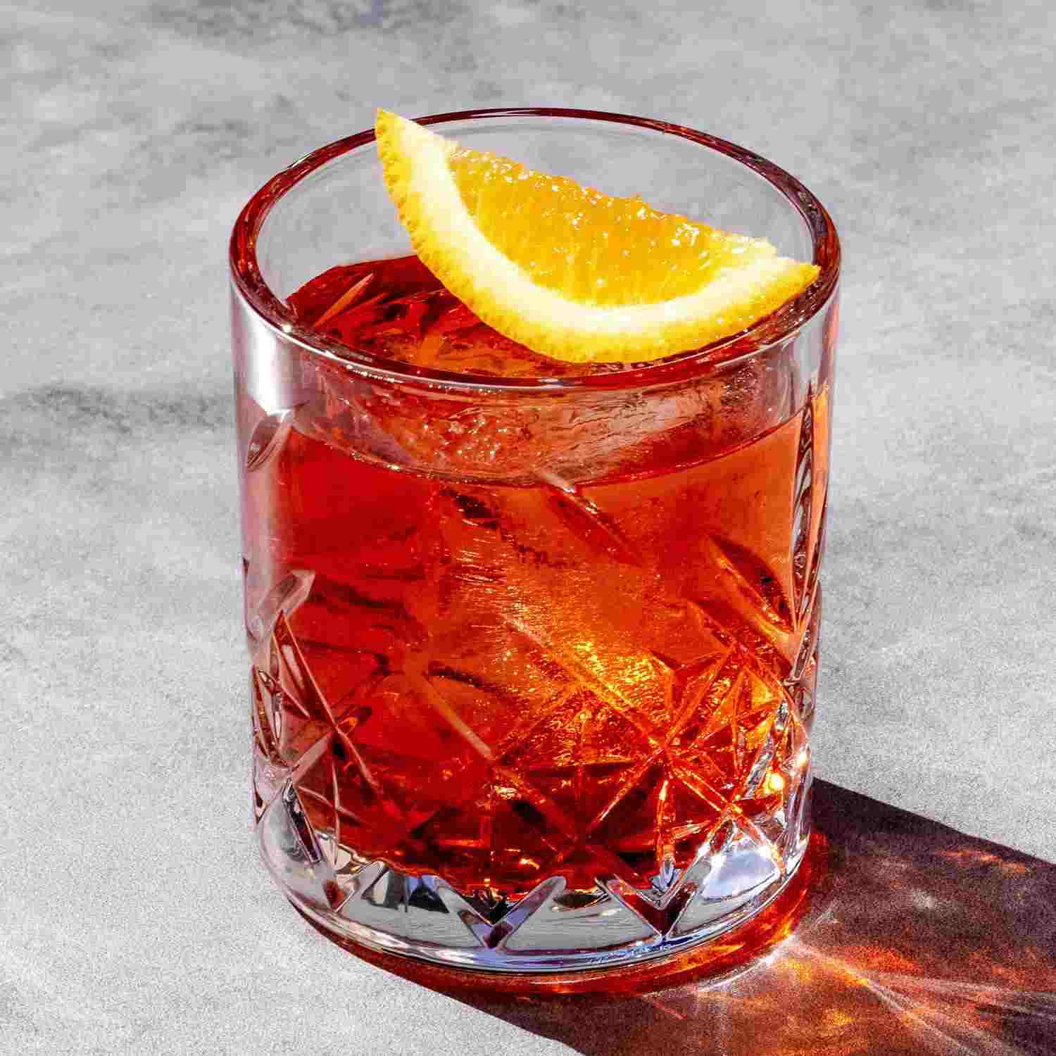 Negroni cocktail served in a rocks glass with orange slice